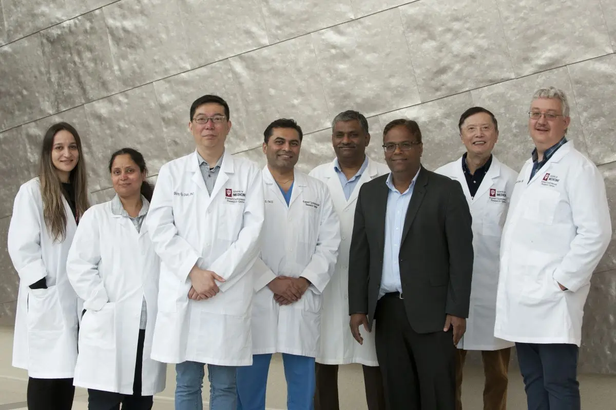 Male and female investigators of the KCVRC Ischemic Heart Disease Research Team pose for a group photo in the Research II Building. 