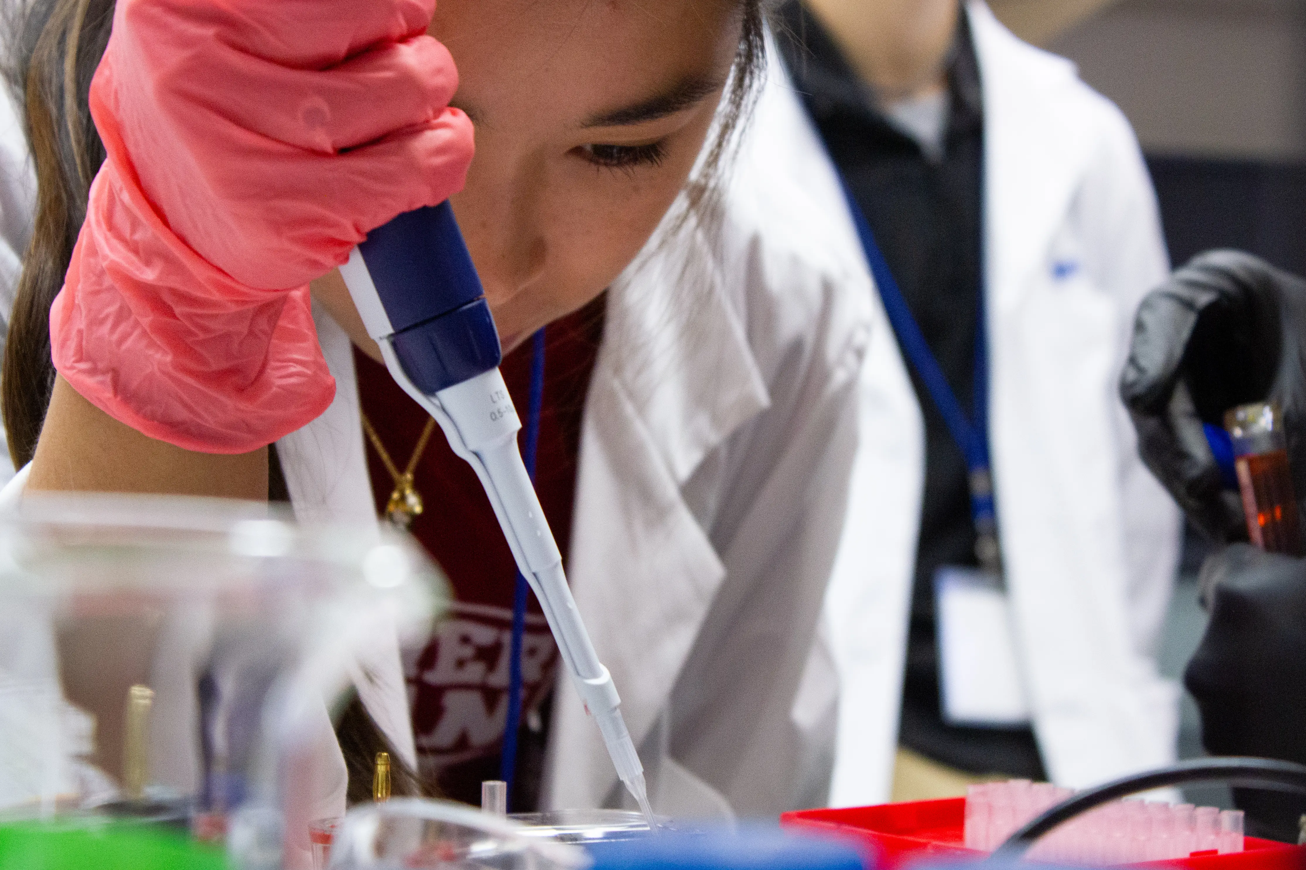 MMIA student working with a pipette