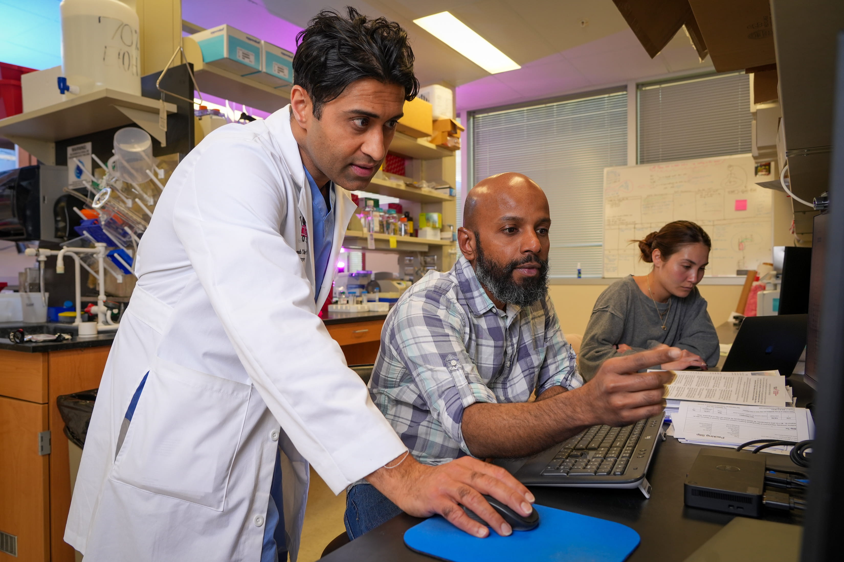 Jignesh Tailor, MD, PhD, and students