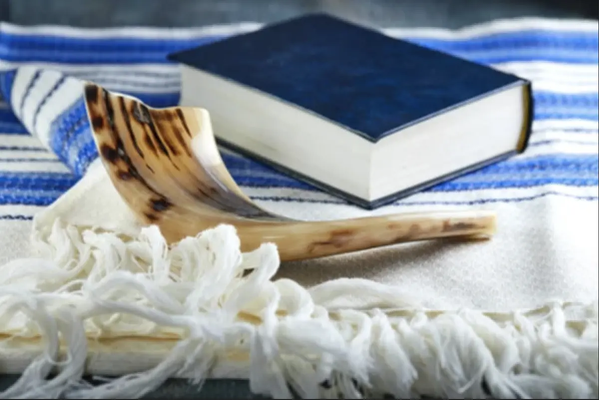 Image of Judaism holy scripture and shofar.