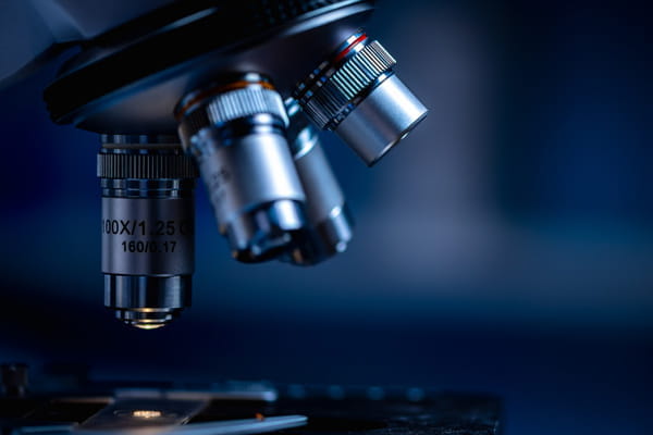 a close up photo of microscope lenses