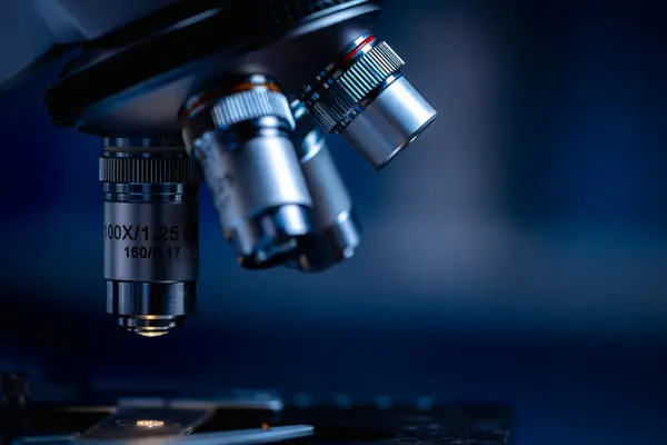 a close up photo of microscope lenses