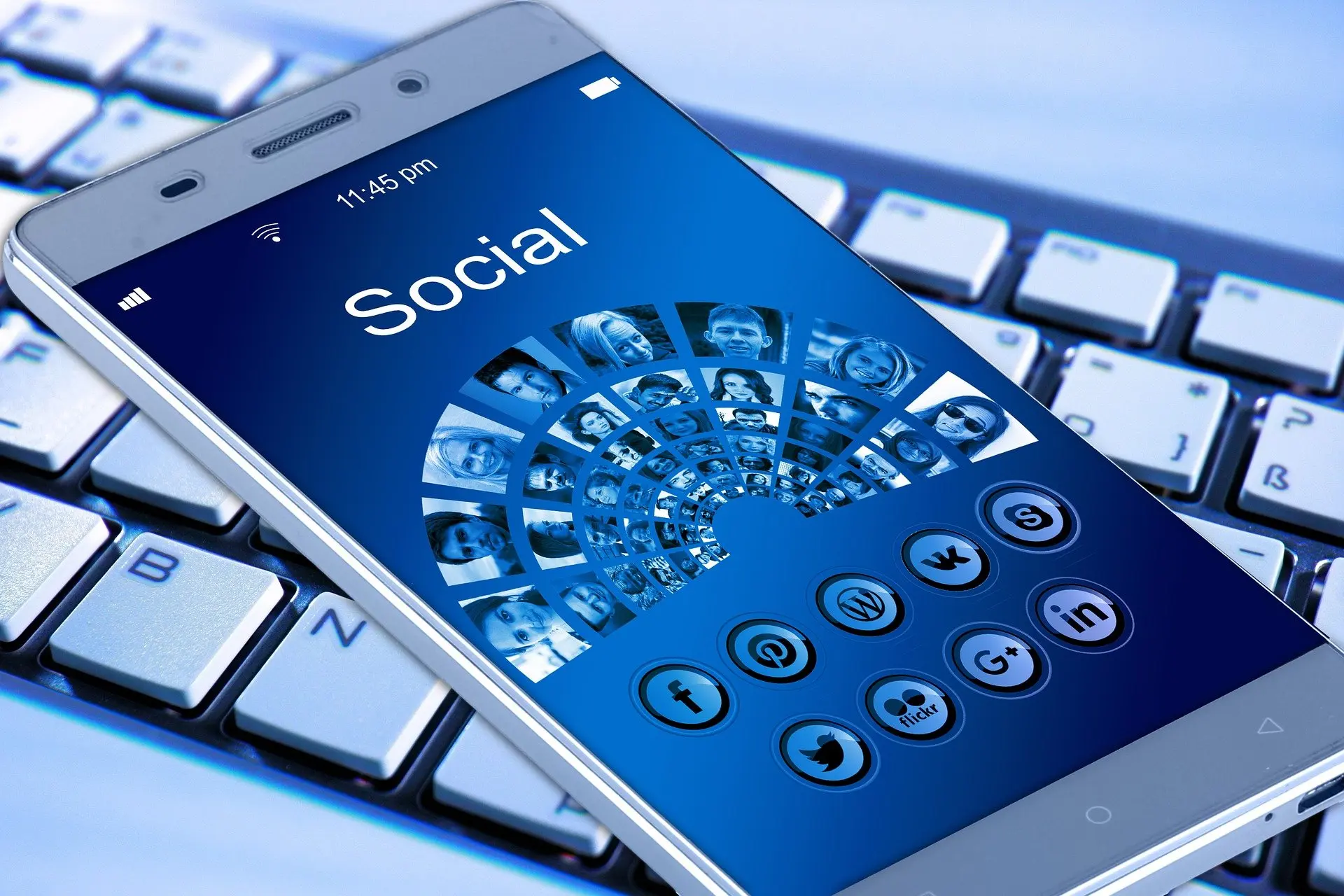 a phone with social media icons on the screen