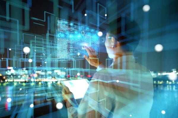 person at computer with research graphics