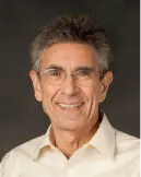 Portrait of Robert wearing glasses smiling 