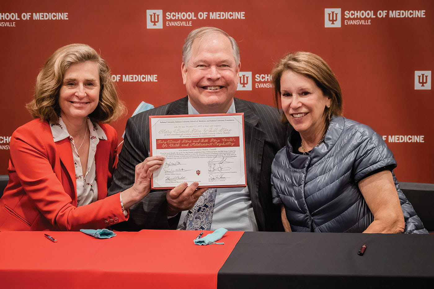 Bill Stone, center, and his wife Mary, right, were joined by IU President Pamela Whitten, left, in celebrating a gift that the couple hopes will tackle a significant clinical and community need in addressing mental health. Stone Center Opening