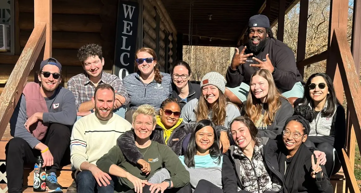 triple board residents gather, smiling