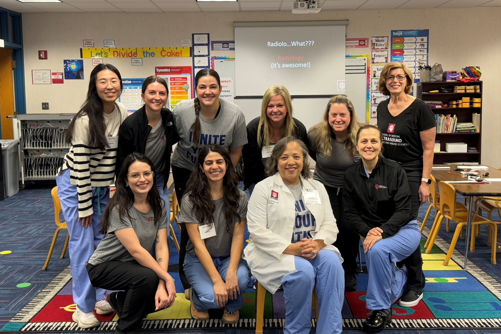 The Women in Radiology group consisting of faculty and trainees smile for a group photo.