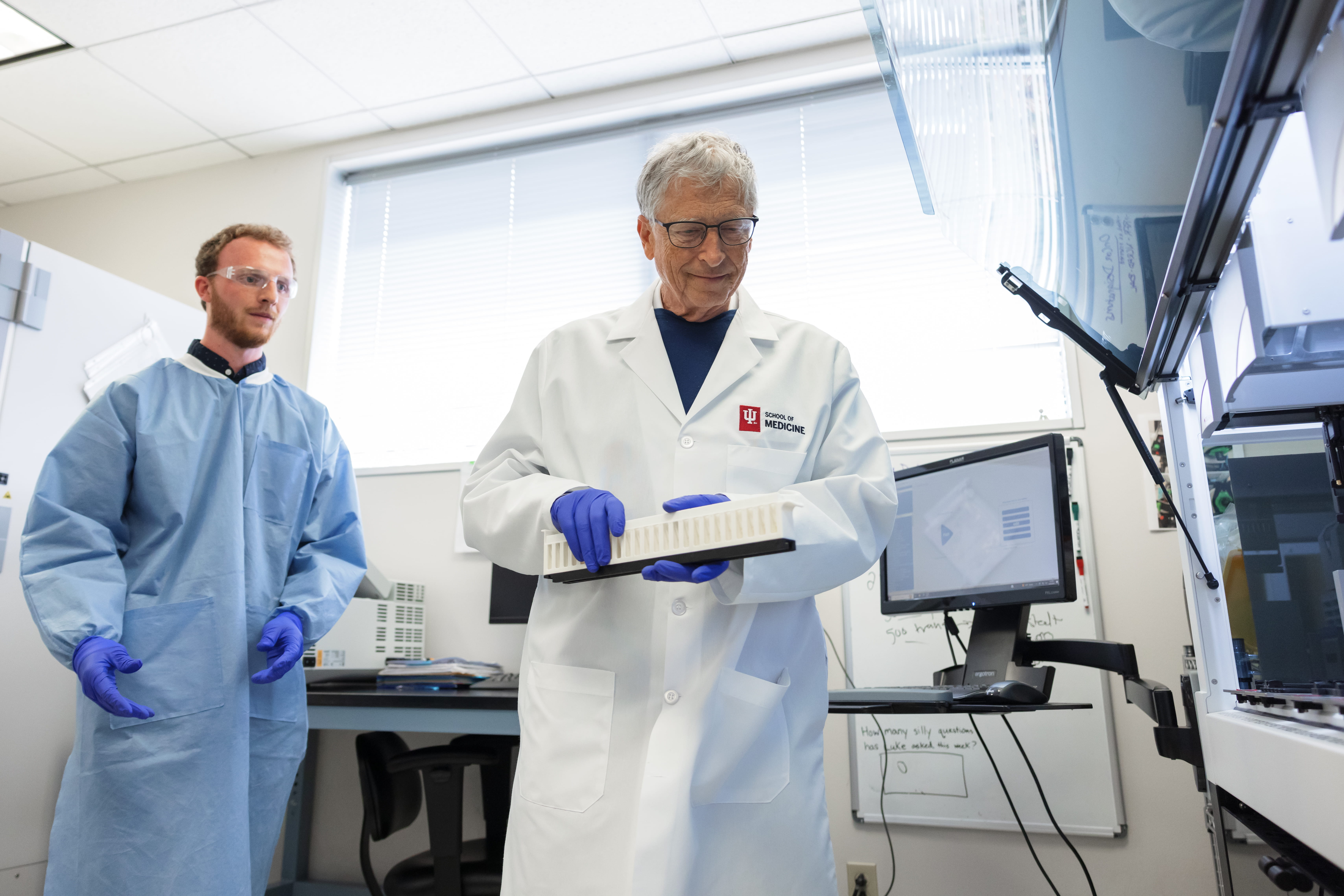 Bill Gates working in an Alzheimers research lab