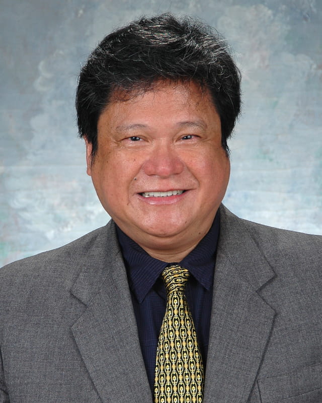 A headshot of Perfecto Caparas