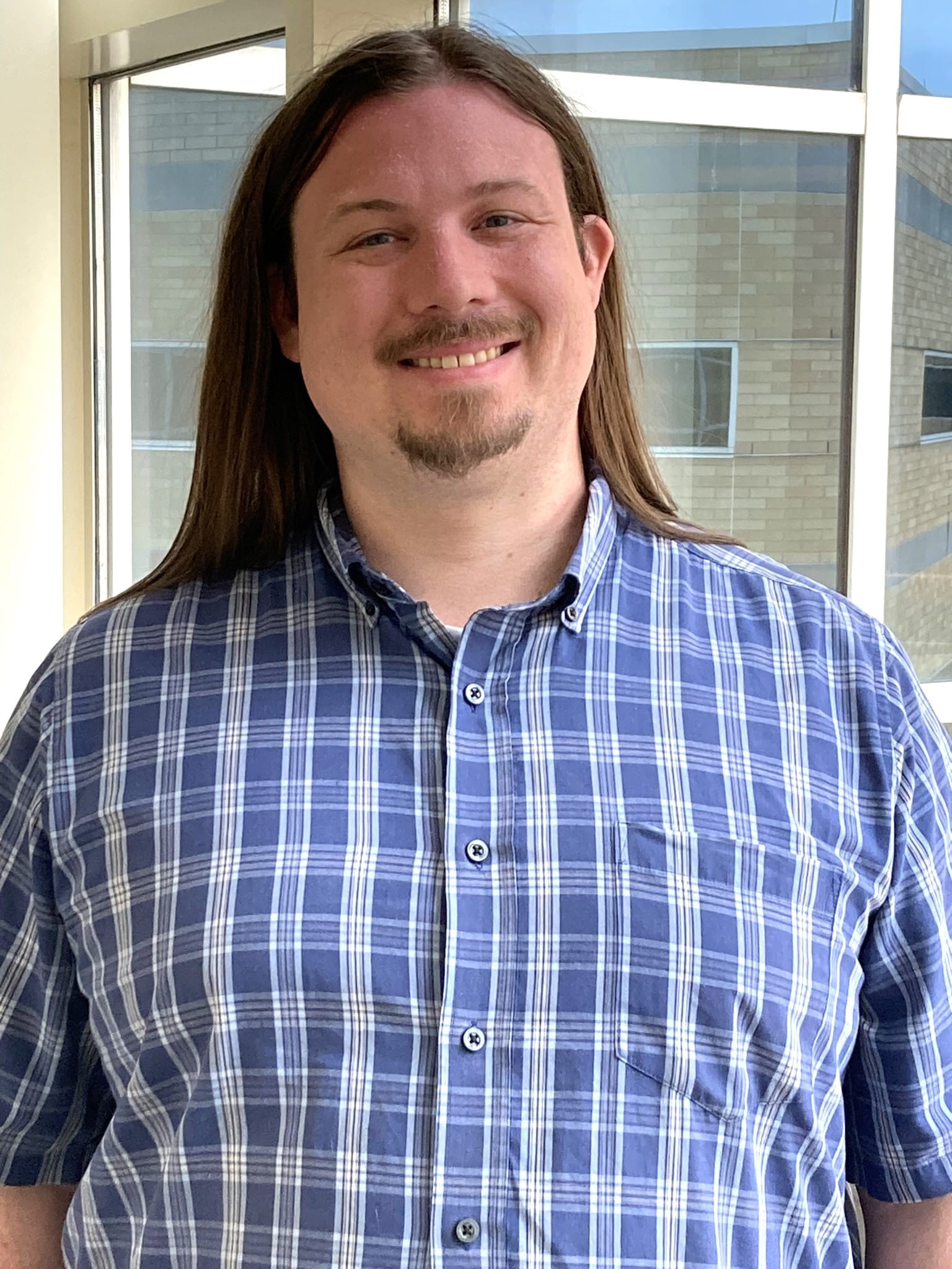 Colin Lamothe, Staff Photo, Clinical Research Coordinator, Division of Cardiovascular Medicine. Picture of Lamothe is vertical and the background is a window. 