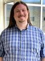 Colin Lamothe, Staff Photo, Clinical Research Coordinator, Division of Cardiovascular Medicine. Picture of Lamothe is vertical and the background is a window.
