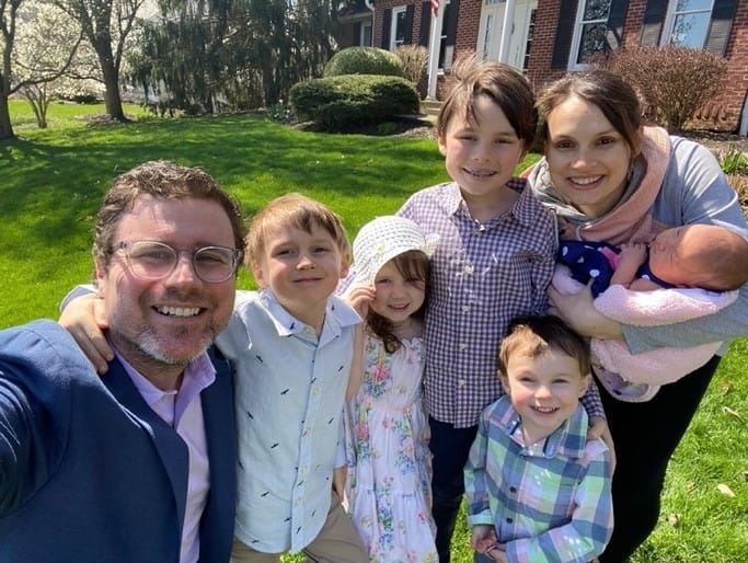 Dr. Emily Fitz smiles with her family.