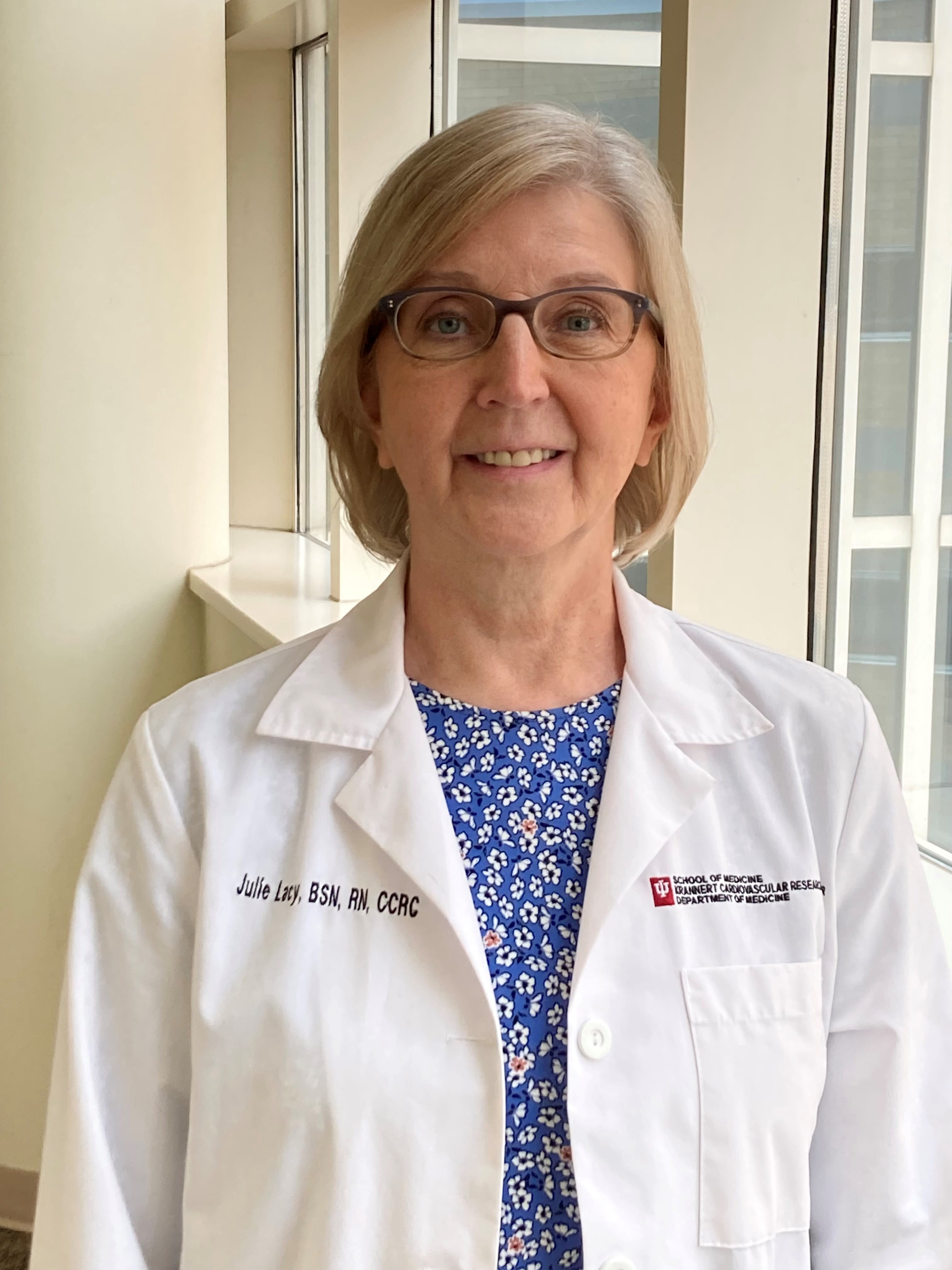 Staff Photo of Julie Lacy, RN, Division of Cardiovascular Medicine. Photo includes a window background.