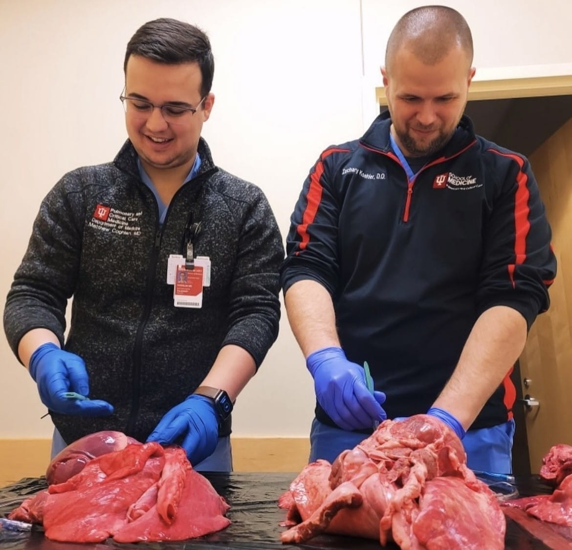 two fellows practice airway training in the sim center