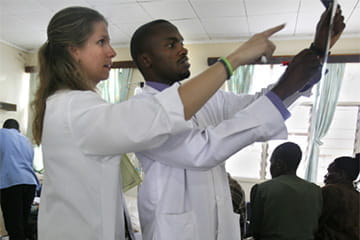 Two Physicians reviewing an x-ray in Kenya