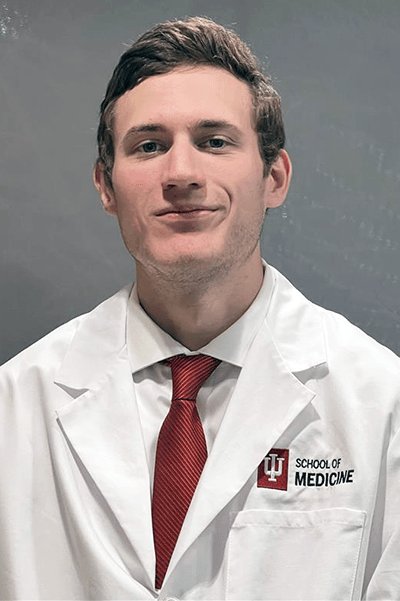 Photo of Max Ottenbacher in white coat