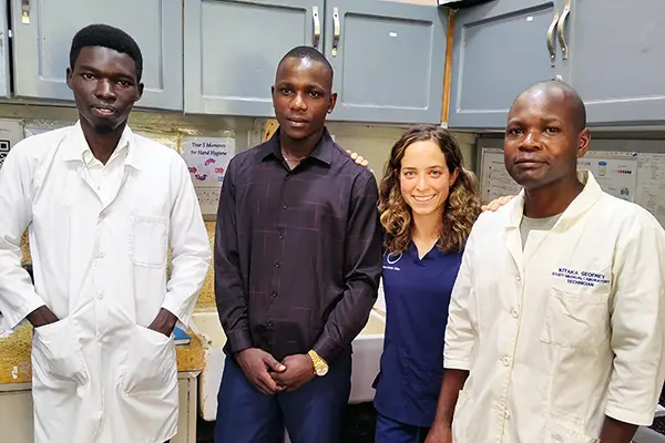 Olivia Bednarki pictured with three other Ugandan health care workers.