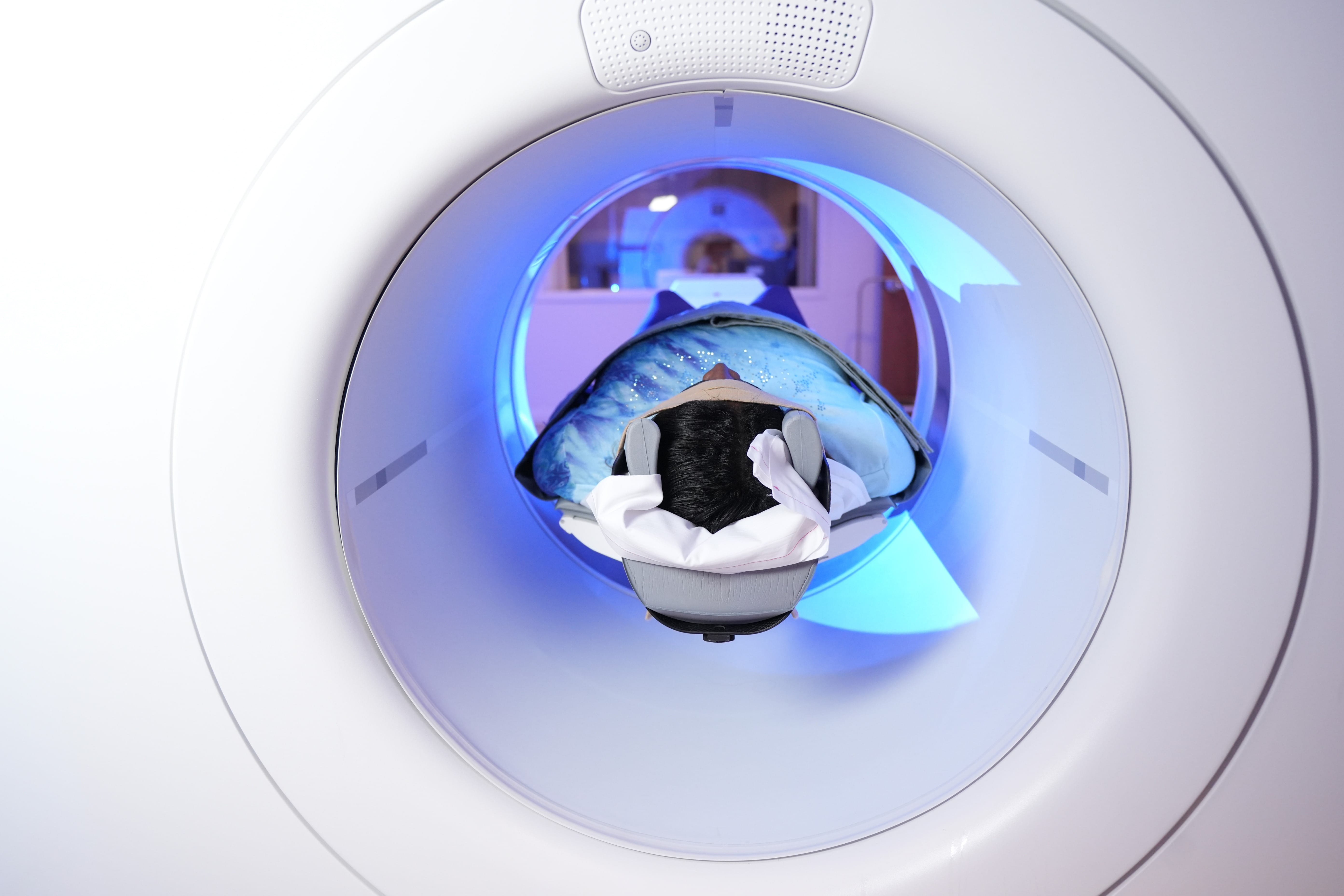 a person lays in an MRI machine