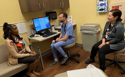 resident physician sitting in clinic