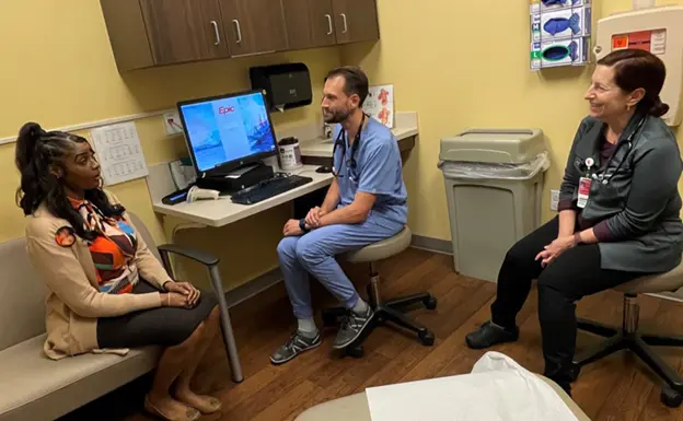 resident physician sitting in clinic