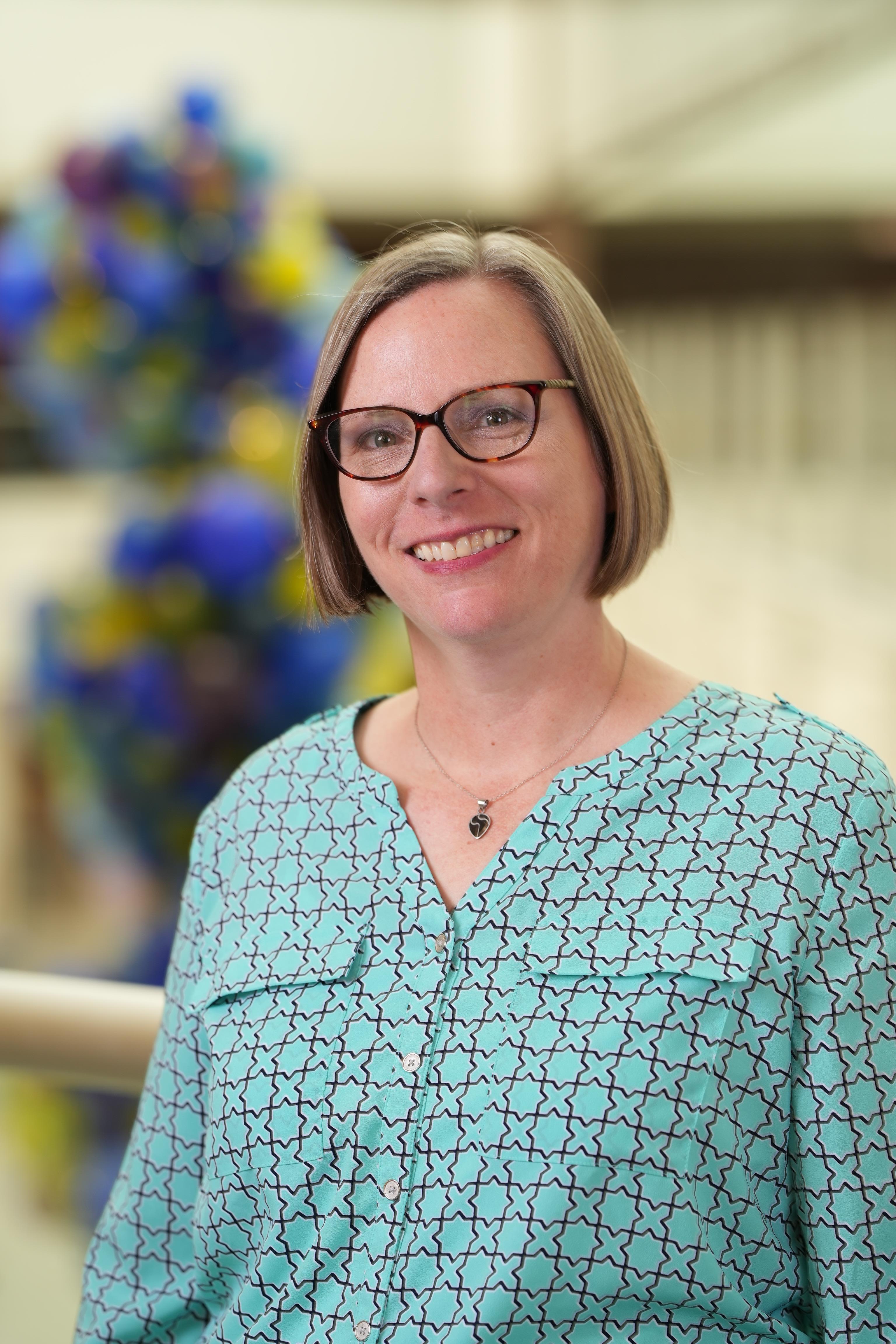 A headshot of Liza Sumpter