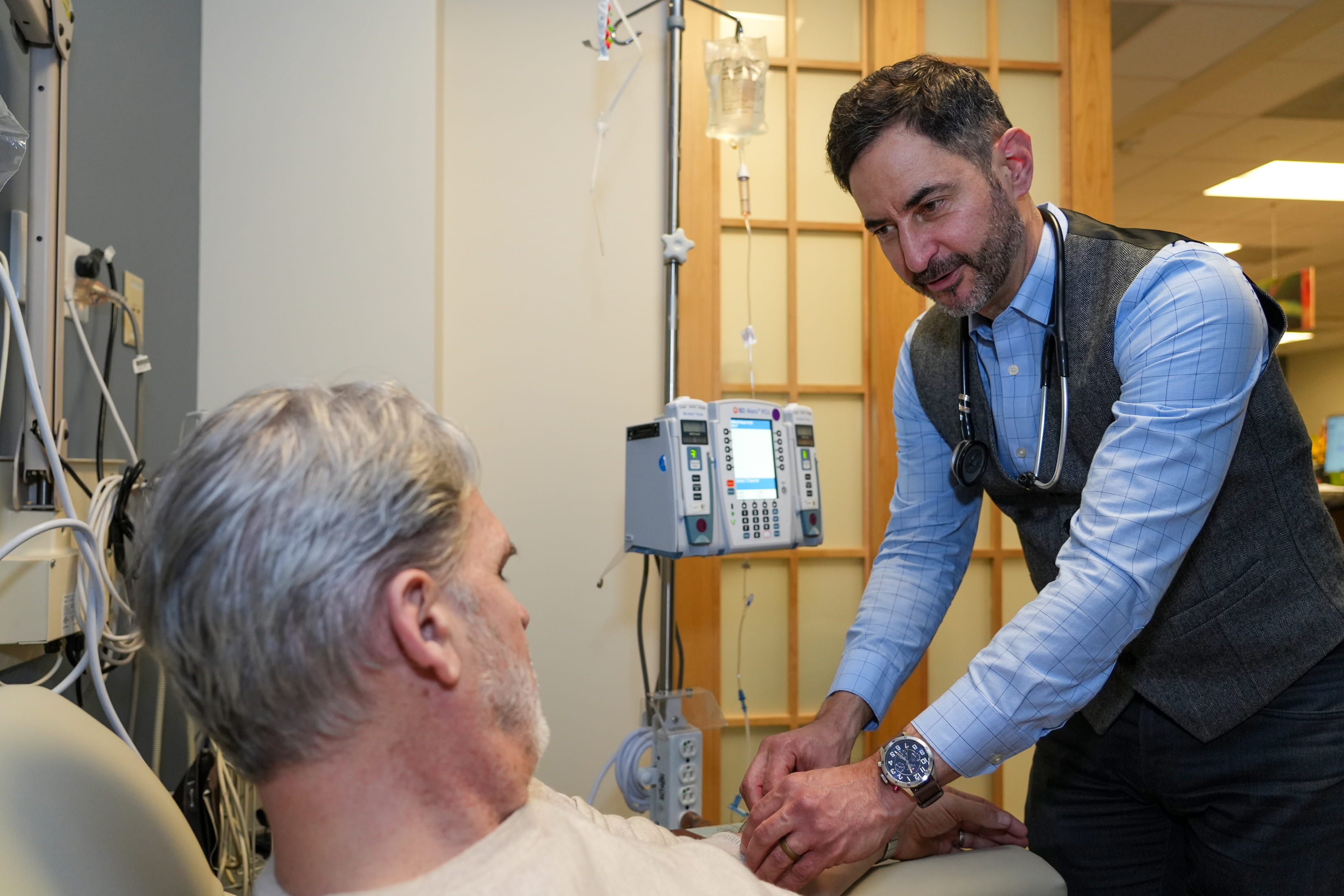 a clinician meets with a clinical trial participant