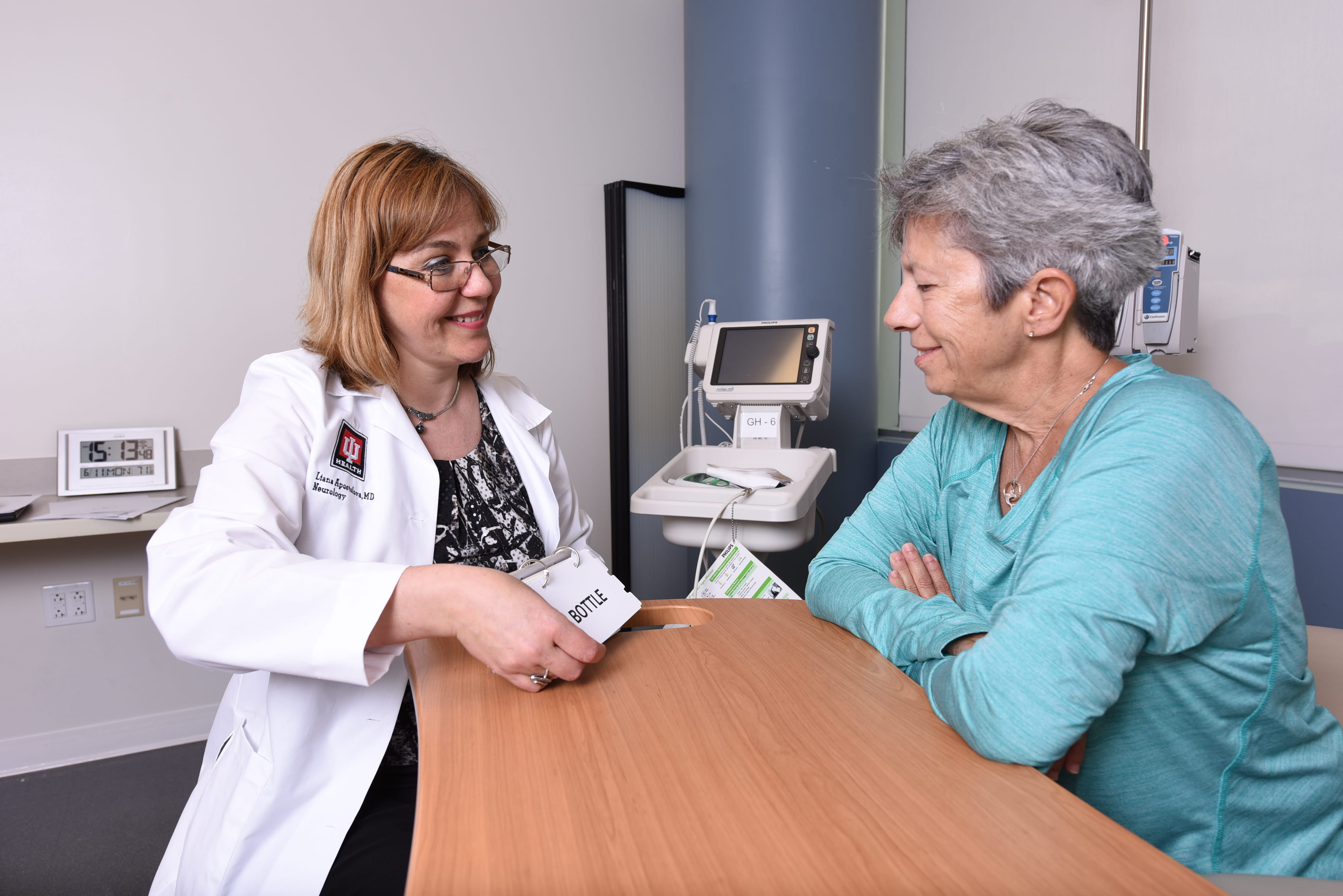 a clinician meets with a patient
