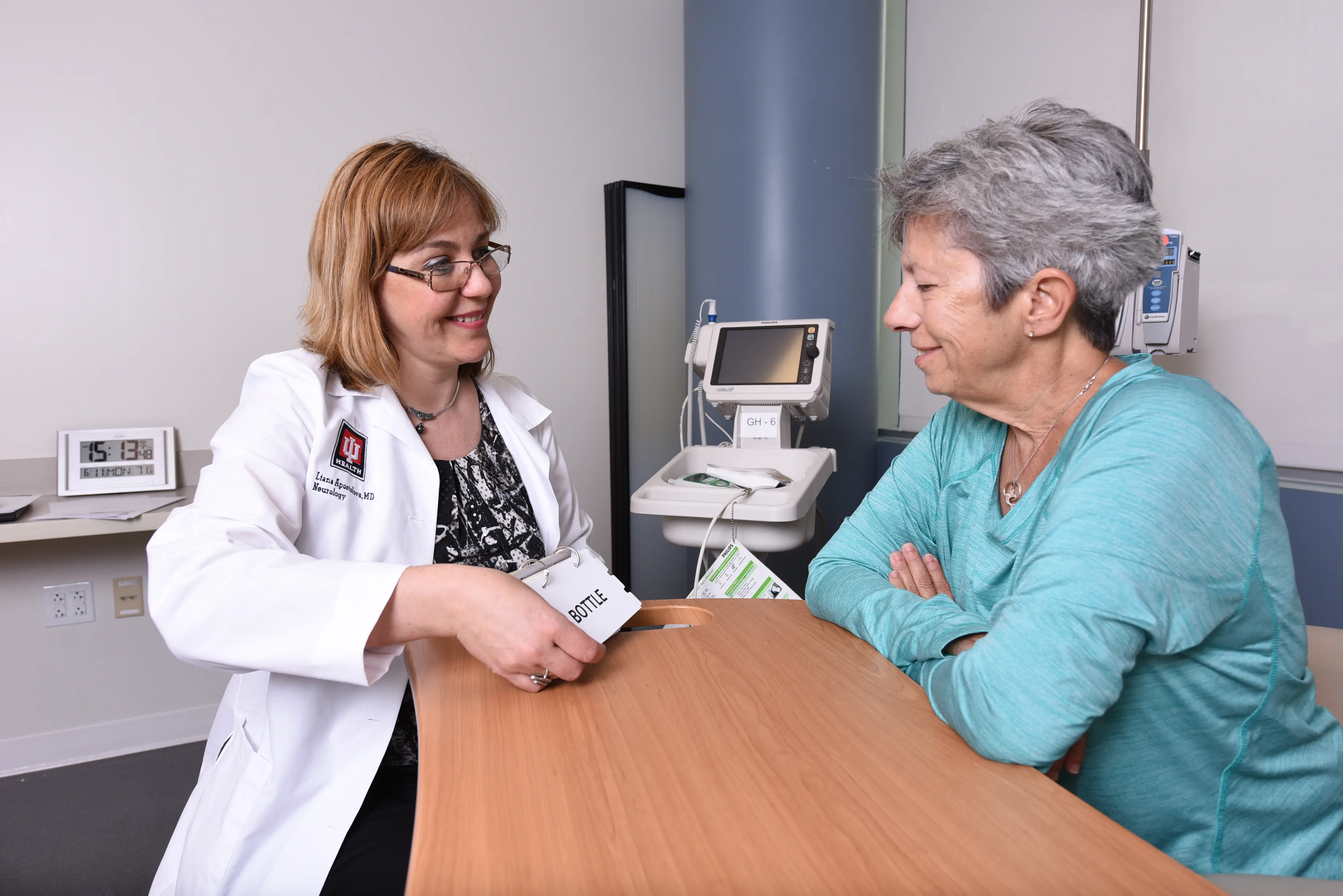 a clinician meets with a patient