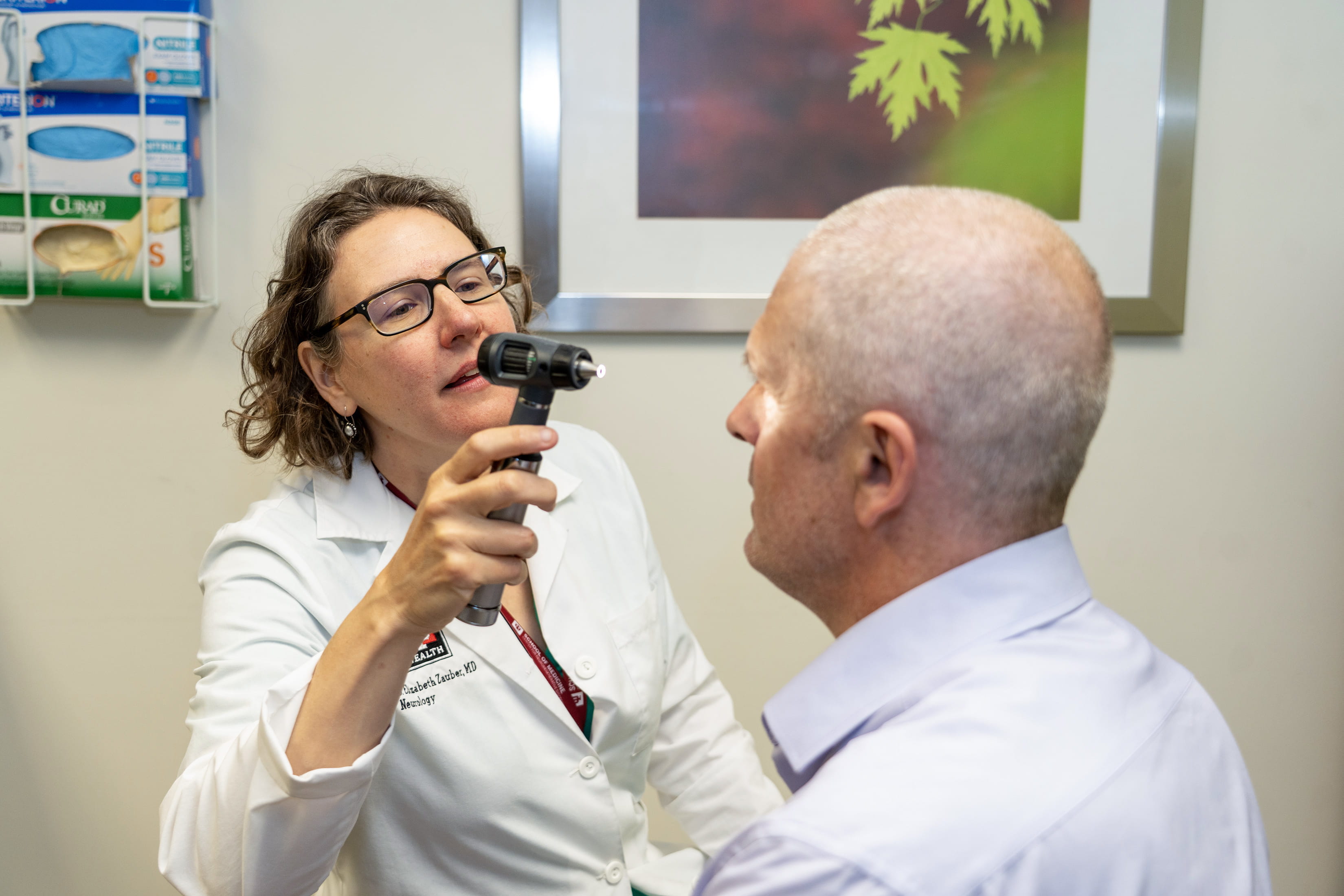 A physician meets with a patient