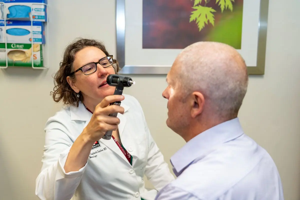 Dr. Elizabeth Zauber examines a patient's eyes in the clinic