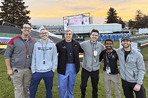 IU med students Dillon Bille, Adrian Morales, Colten Duvall, Luke Haag, Adhitya Balaji and Oliver Hobson pose for a photo in front of the Indy 500's Snake Pit.