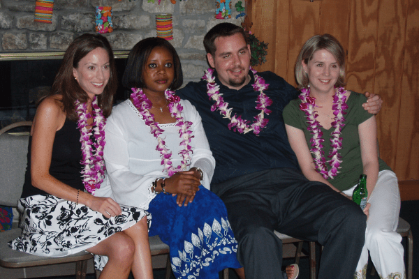 Four former IU trainees pose for a photo wearing Hawaiian clothing in 2006.