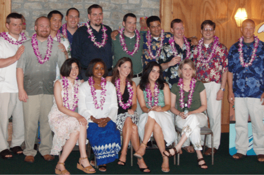 A group of trainees pose for a group photo wearing Hawaiian clothes in 2006.