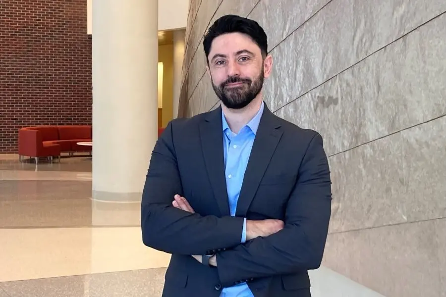Khalid Youssef stands in the atrium of the Research II Building. 