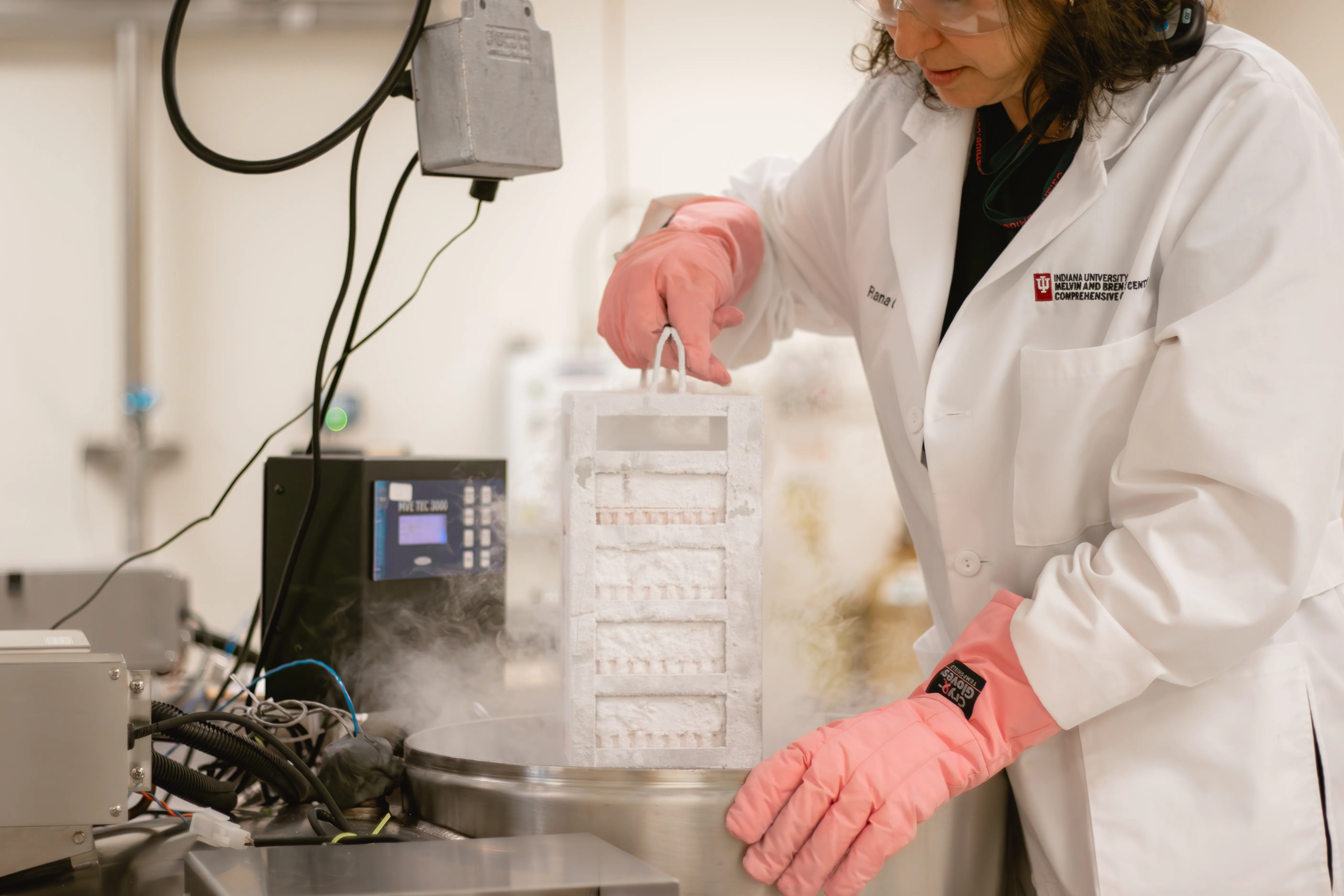 A woman works with tissue samples in a lab