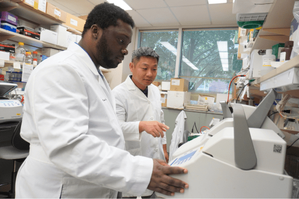 Two researchers work in a lab