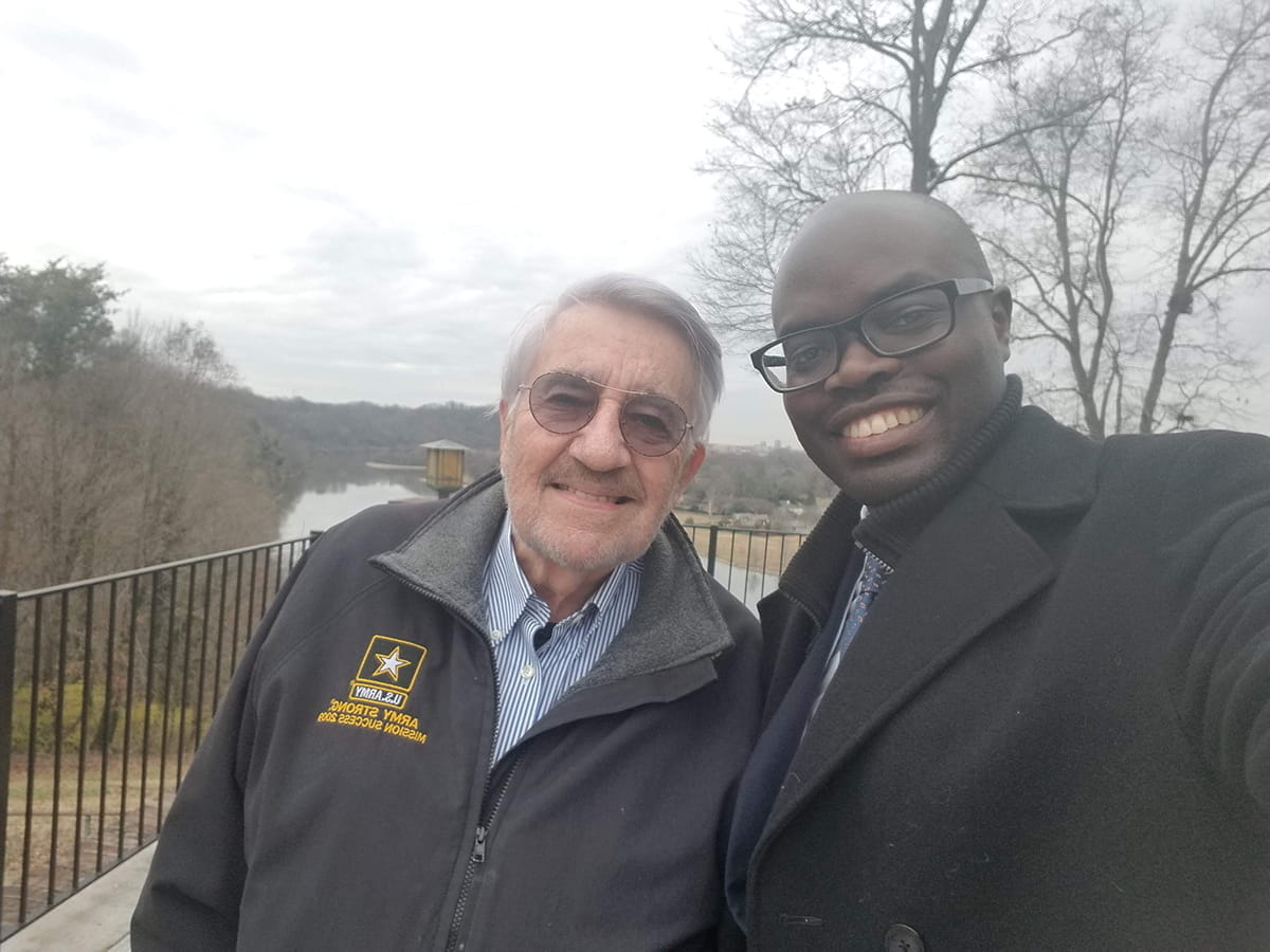 David Gerkin poses with Innocent Byiringiro