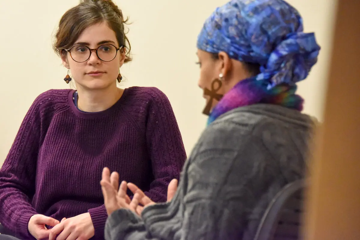 A resident practices communications skills during a session of IU Talk. 
