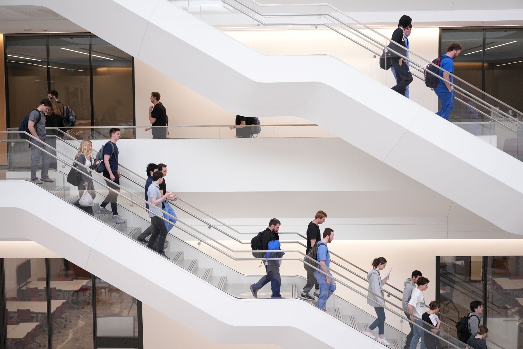 People walking down the stairs in a building