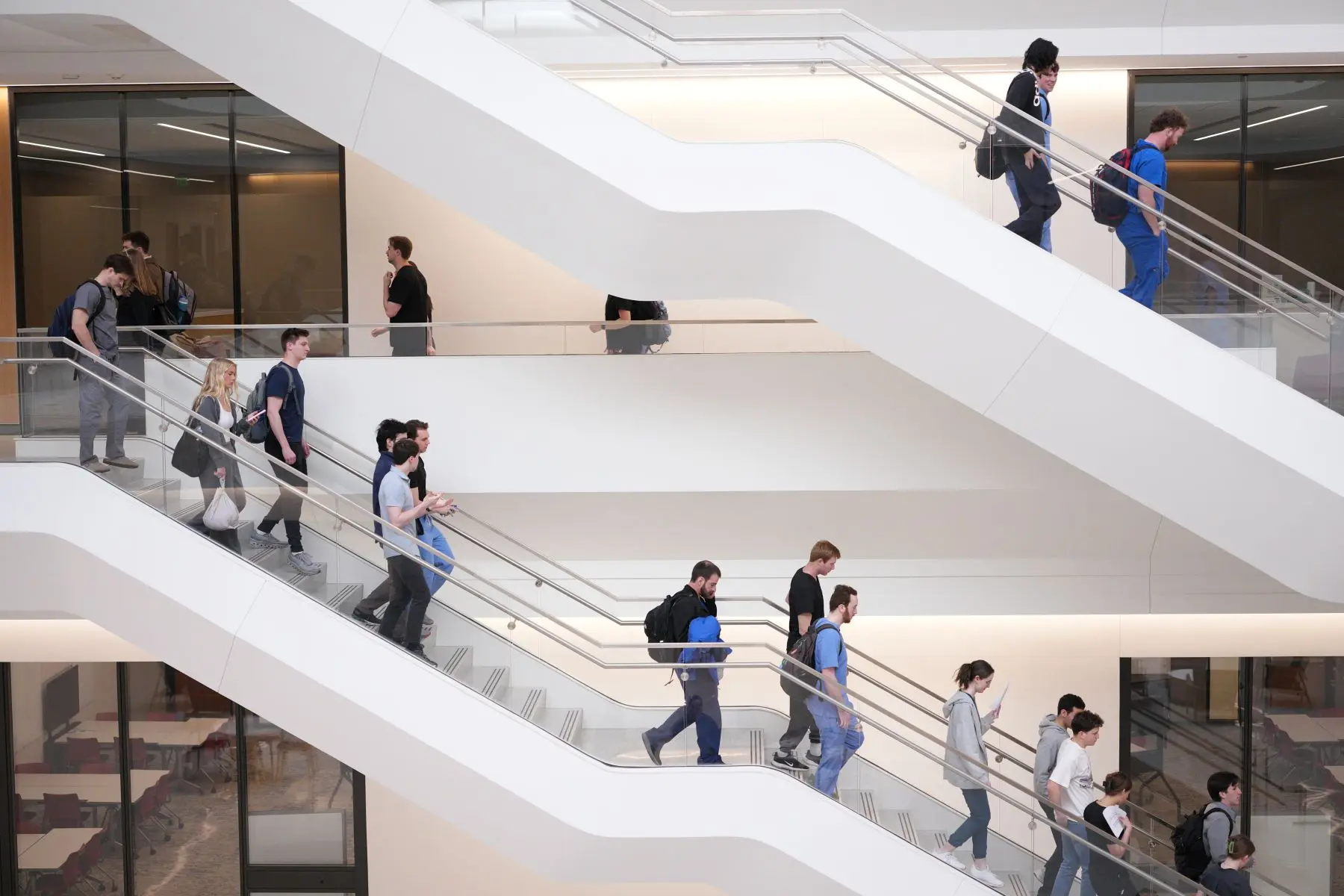 People walking down the stairs in a building