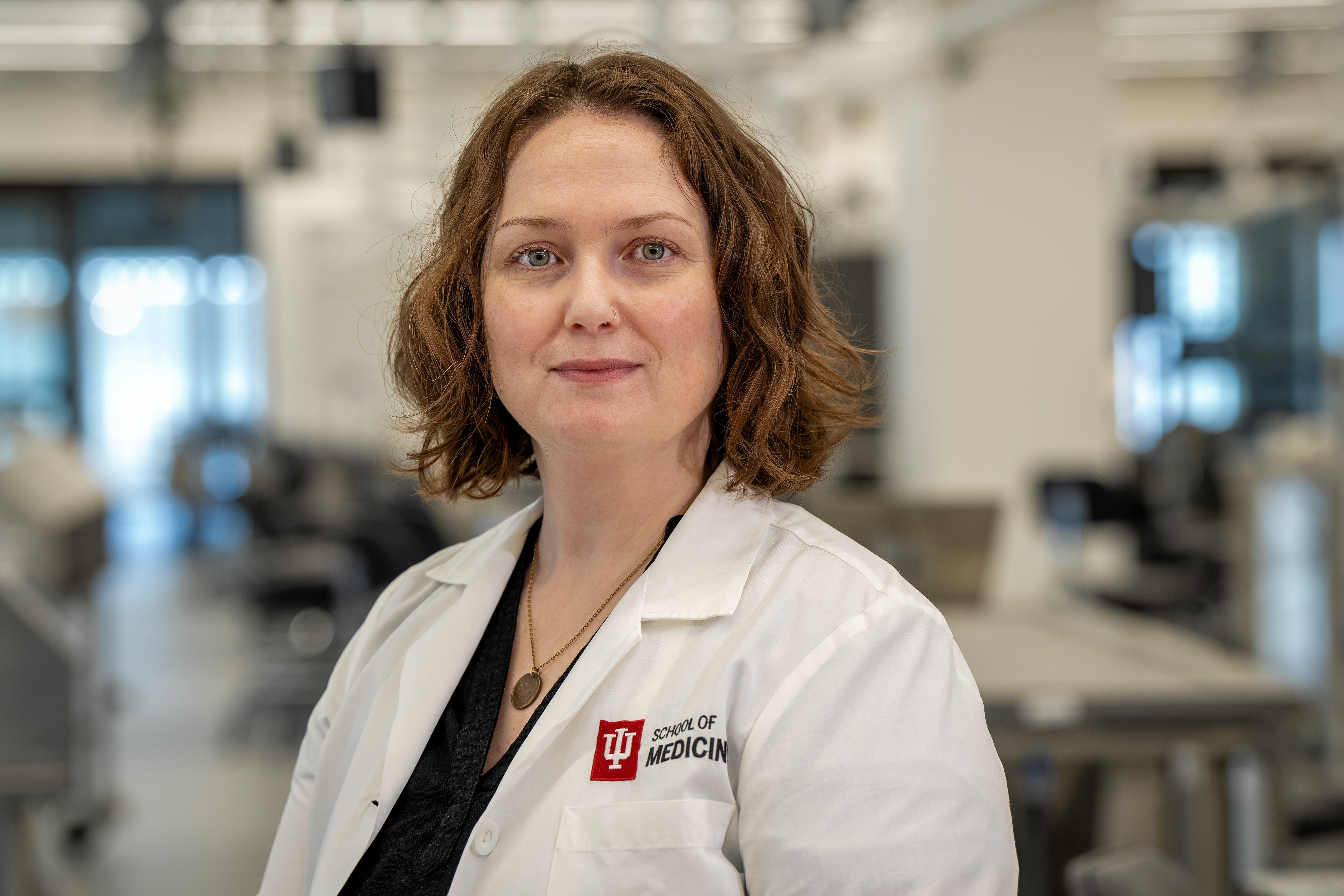 Person standing with a lab coat