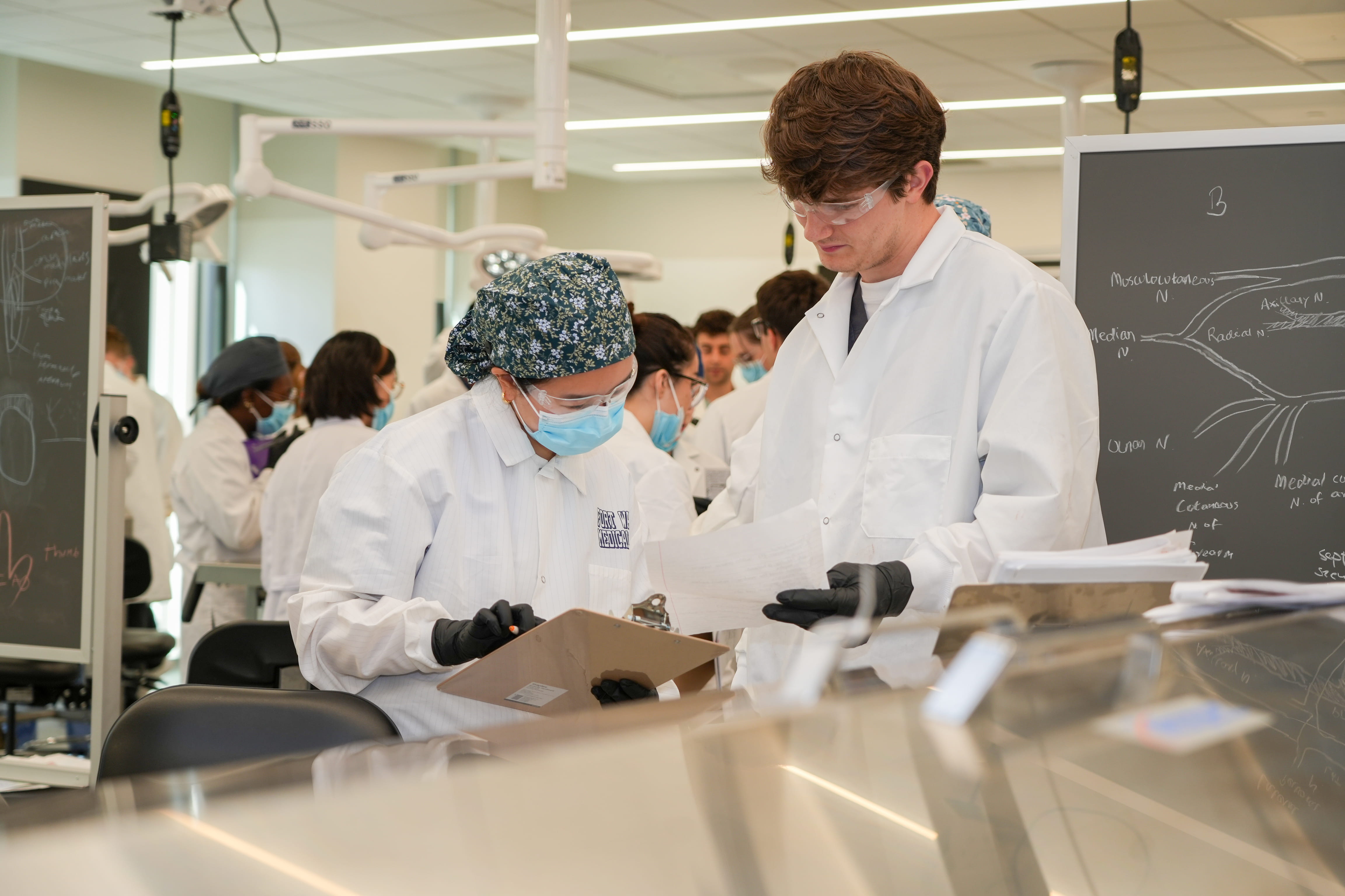 2 students in lab working