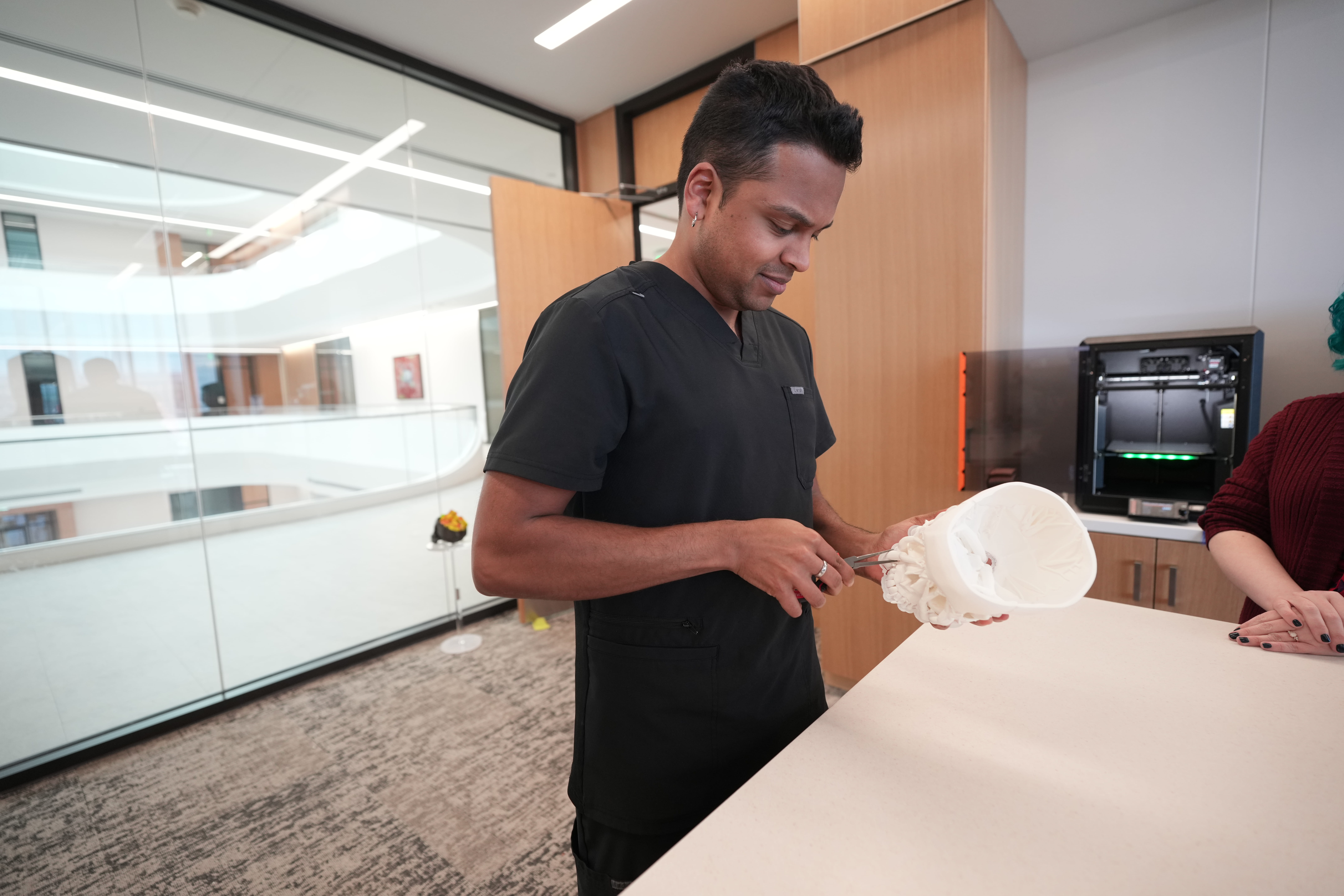 A student working with a 3d printed project