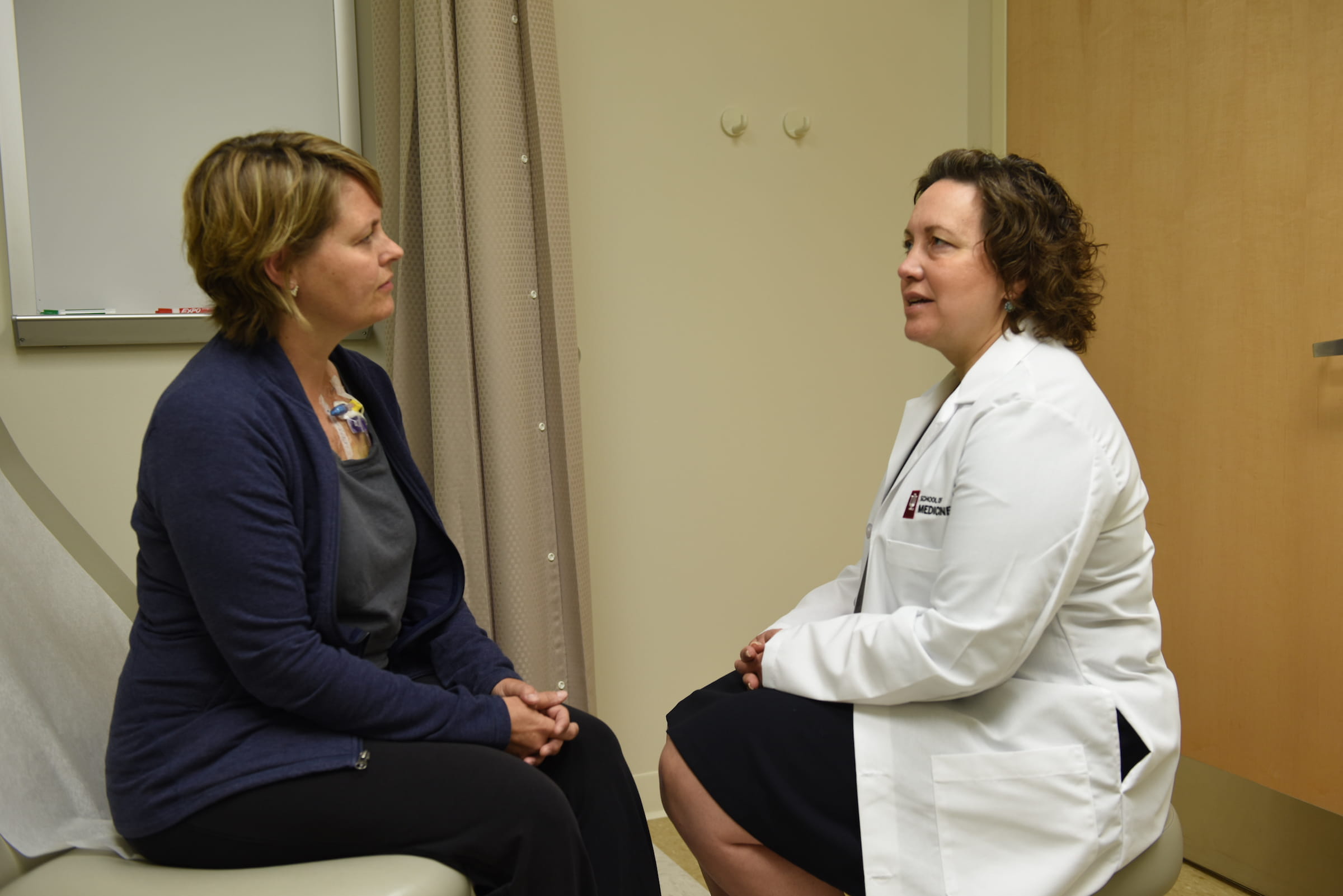 Breast cancer patient speaks with physician