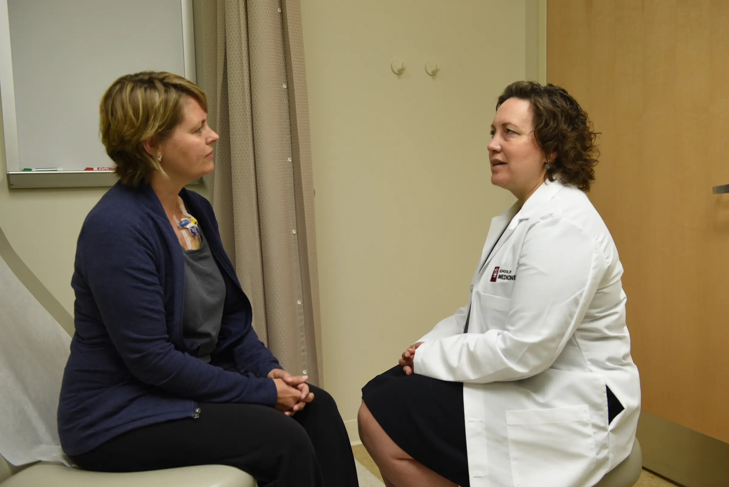 Breast cancer patient speaks with physician