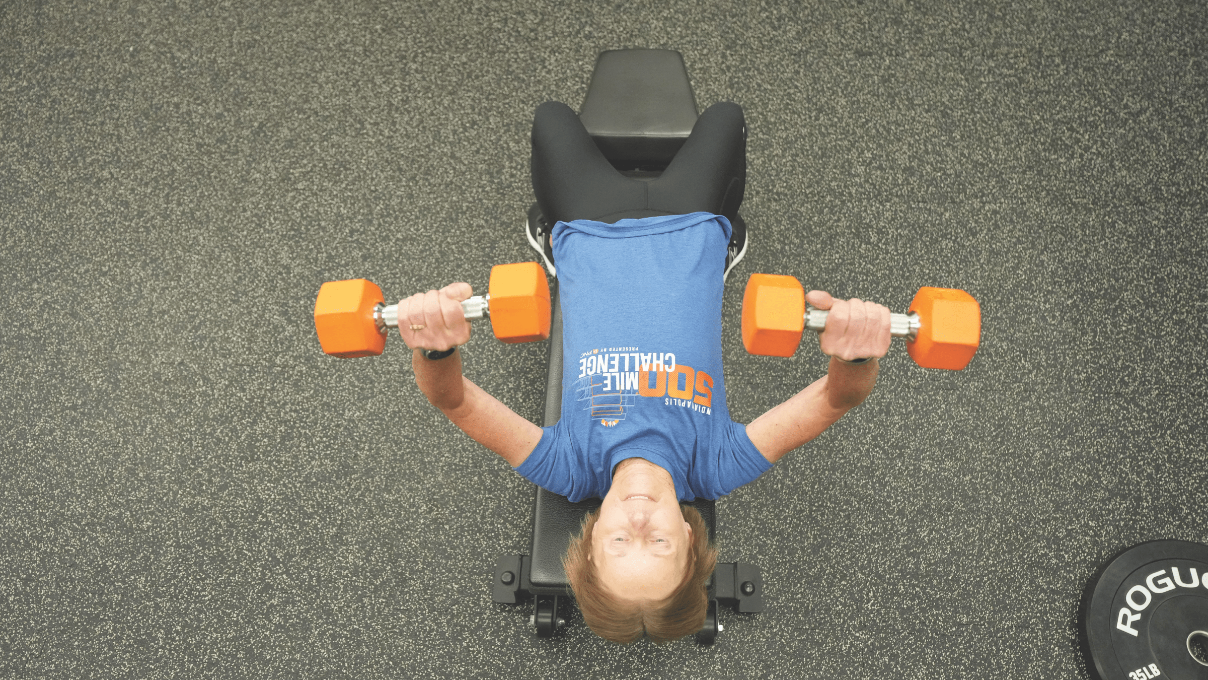 A girl doing bench press
