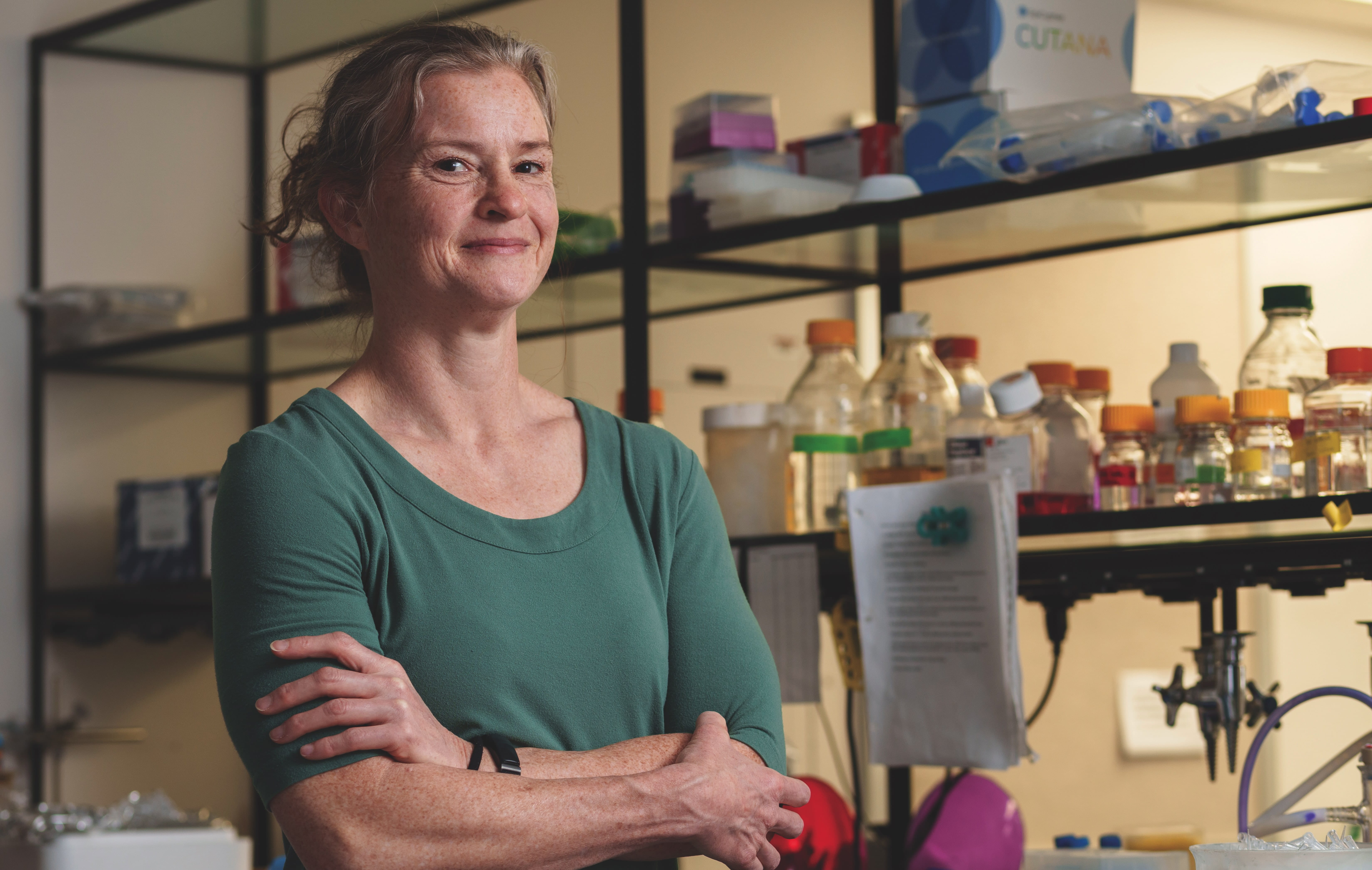 A person standing with arms crossed