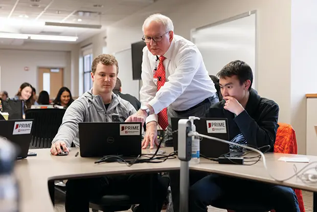 Jay Hess working with students in class