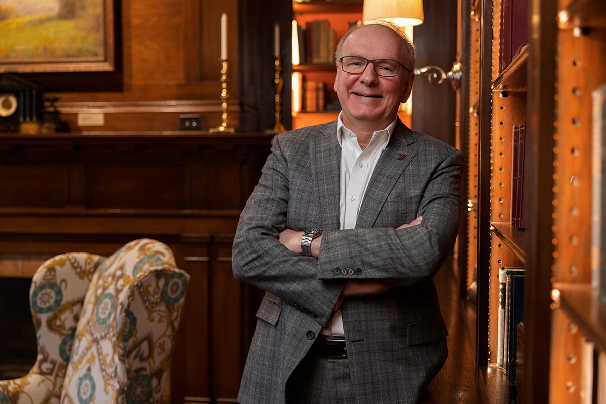 Since Jay Hess’ arrival, IU School of Medicine has more than doubled its funding from the National Institutes of Health and cemented itself as the nation’s largest medical school. Dean Hess with his arms crossed in a home library